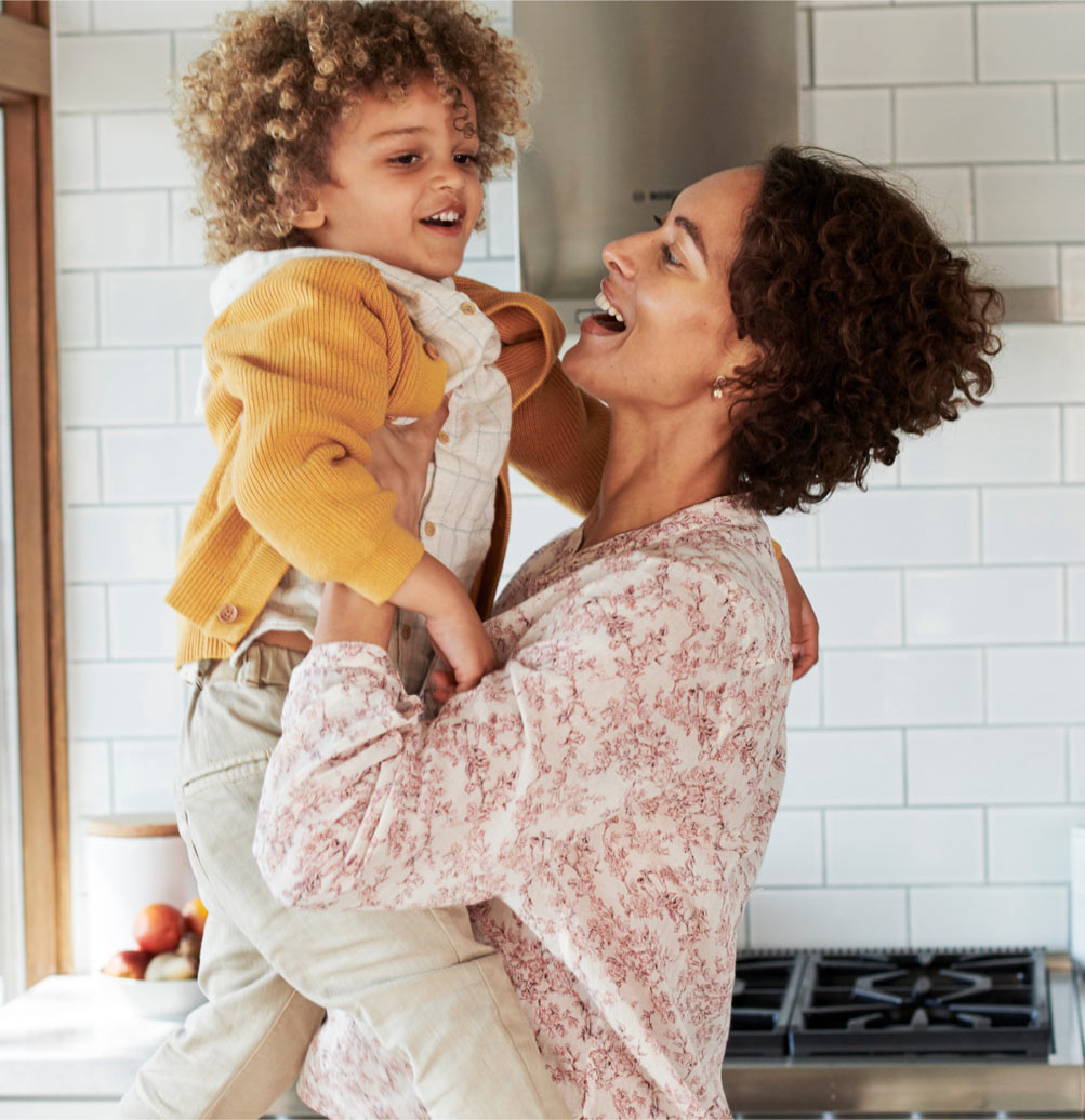 Smiling woman holding child